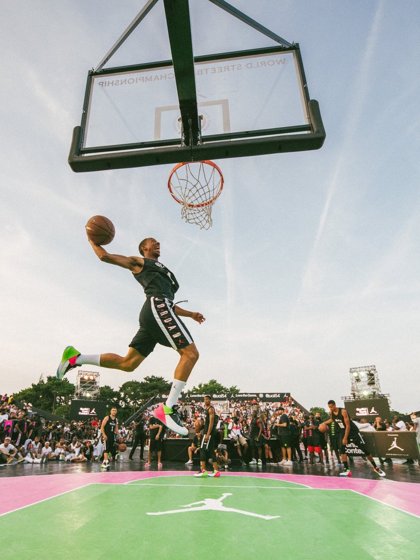 Jonathan Clark dunking on an outdoor court