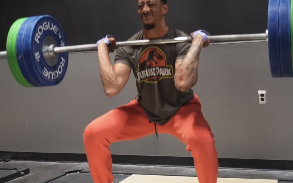 Jonathan Clark training with a barbell back squat