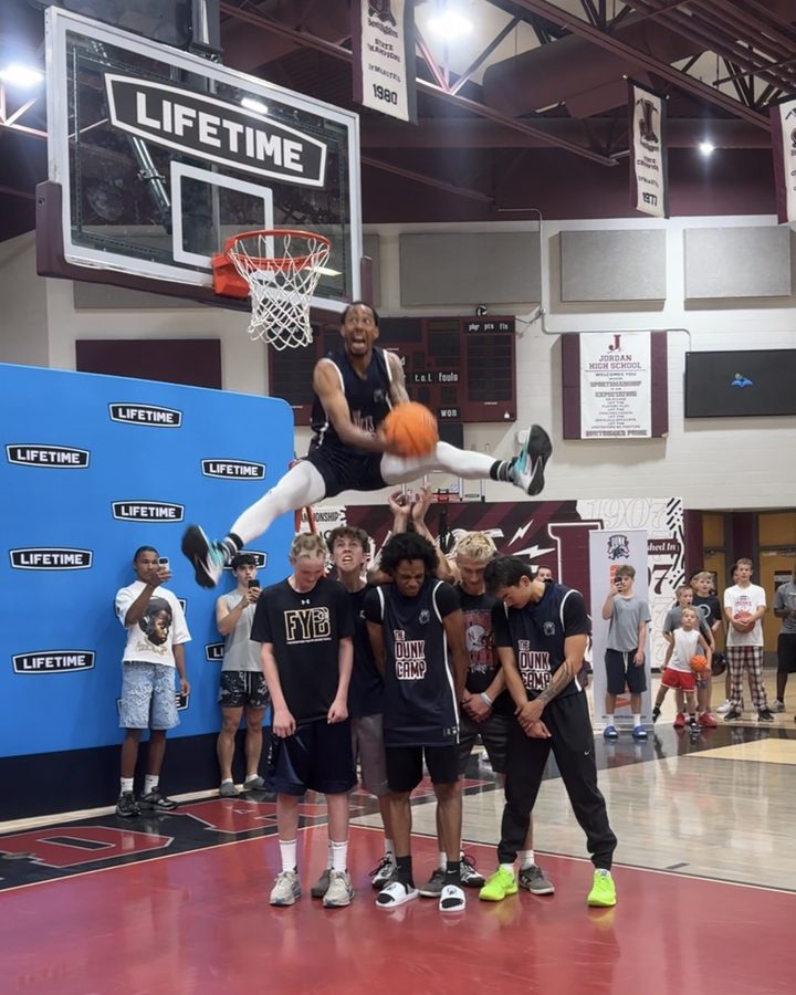 Jonathan Clark coaching young athletes in a gym